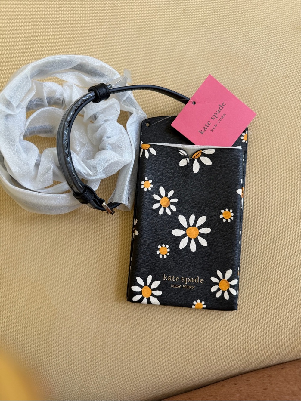 kate spade Black Daisy Phone Pouch with Yellow Centers